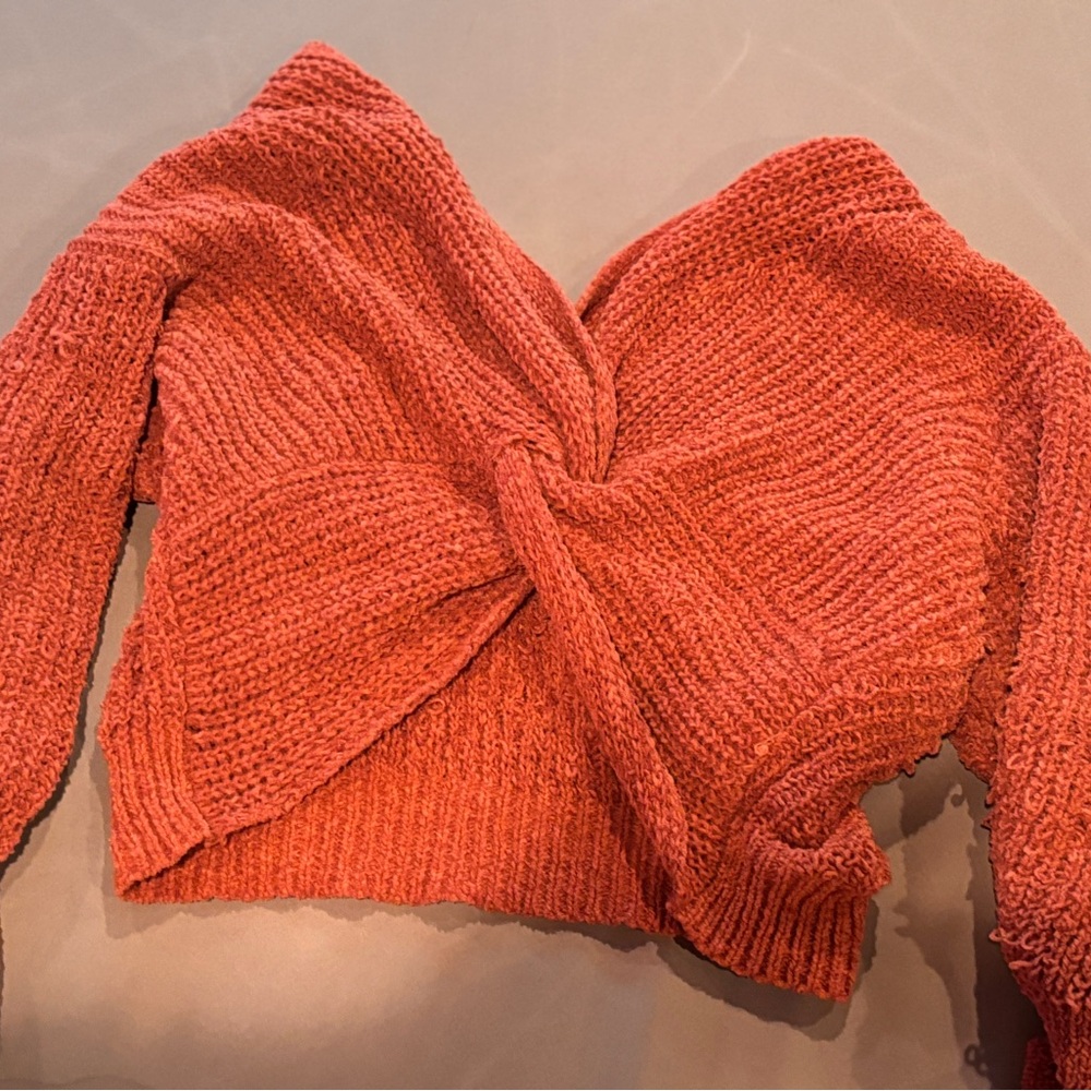 Pink cross sweater